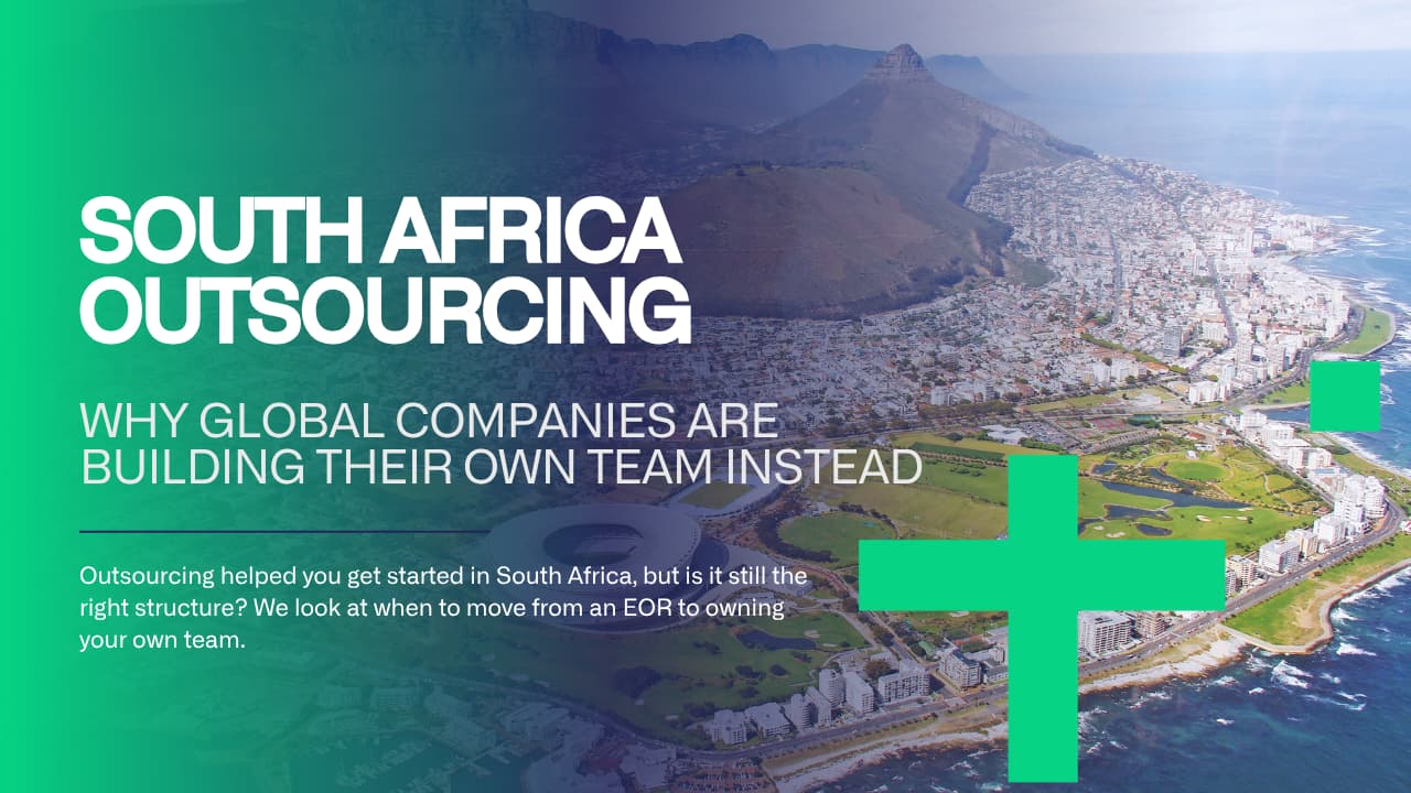 International team reviewing South Africa outsourcing options on a laptop